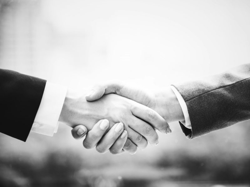 A close up of a business handshake